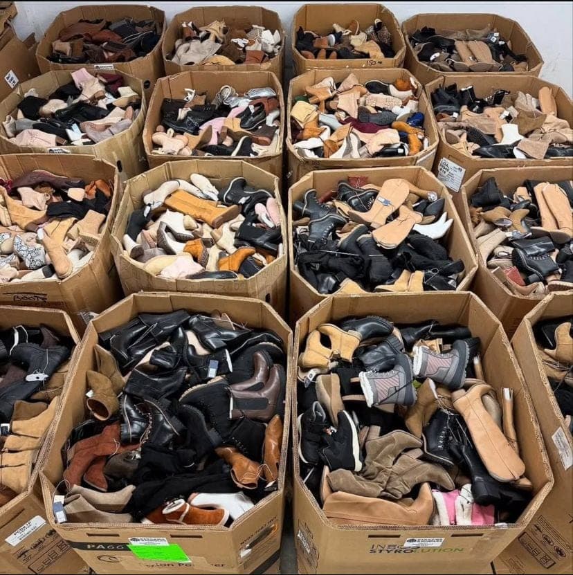 Womens boots wholesale pallet Grade A 100 pairs stacked on shipping skid in US warehouse